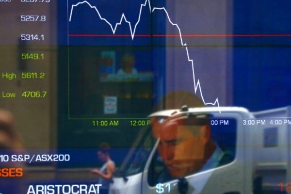 Australian shares slip slightly as mining and gold stocks drag