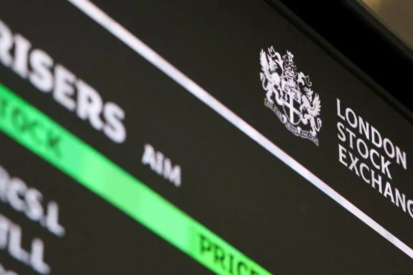 FTSE 100 today: Pound strengthens, UK Stocks react to mixed corporate news and softer services activity