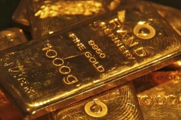 Gold slips slightly after hitting record high