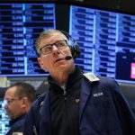 U.S. stock futures struggled to find direction on Tuesday. The mood in the market was cautious. Futures linked to the S&P 500 fell by 0.6%. Nasdaq 100 futures dropped by 1.1%. At the same time, Dow futures managed to rise by 0.2%. This comes after a strong previous session. The S&P 500 and Nasdaq had reached fresh record highs. But the Dow Jones had ended lower. Investors are now confused. There is no clear trend. Some are booking profits after the recent rally. Others are waiting for more clarity before making moves. AI stocks fall after OpenAI concerns Technology stocks faced pressure. The drop was linked to concerns around OpenAI. Reports suggest the company missed its targets for user growth and revenue. It failed to reach its goal of 1 billion weekly users for ChatGPT by 2025. It also missed several monthly revenue targets this year. This has raised doubts about its future growth. There are also worries about rising costs. The company is spending heavily on data centers. Executives fear revenue may not grow fast enough to support these expenses. This news impacted companies connected to OpenAI. Oracle shares fell sharply. Microsoft and Nvidia also slipped. In Japan, SoftBank Group saw a big drop. The fall in AI stocks has made investors nervous. This sector has been a major driver of market growth. Any weakness here affects overall sentiment. Iran tensions and oil prices worry markets Geopolitical tensions are also adding pressure. Donald Trump is currently reviewing Iran’s latest peace proposal. Reports suggest he is not satisfied with it. The main issue is Iran’s nuclear program. The proposal delays talks on this topic. This has reduced hopes for a quick resolution. The Strait of Hormuz remains mostly closed. This route is critical for global oil supply. Around 20% of the world’s oil passes through it. Because of this, oil prices are rising again. Higher oil prices increase inflation risks. This may force central banks to keep interest rates high. Earnings season and Fed decision in focus Investors are also watching earnings closely. This is one of the busiest weeks of the season. Around 35% of S&P 500 companies will report results. Some companies have delivered strong updates. General Motors posted better than expected results and raised its outlook. Coca-Cola also gave a positive forecast. However, not all results were strong. United Parcel Service reported a sharp drop in profit. Hilton and Spotify also saw declines in their stock prices. Another key event is the upcoming decision by the Federal Reserve. Markets expect no change in interest rates. But investors will closely watch comments from Jerome Powell. Right now, the market mood is tense. AI concerns, oil prices, and global politics are all pulling in different directions. Investors are waiting for clearer signals before making big moves.