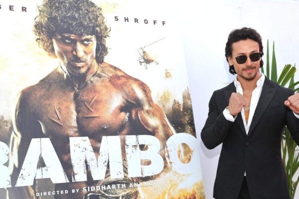 Tiger Shroff with a poster of 'Rambo'