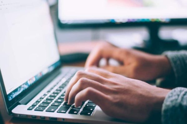 Business owner optimizing his website through SEO strategies to boost his Google ranking